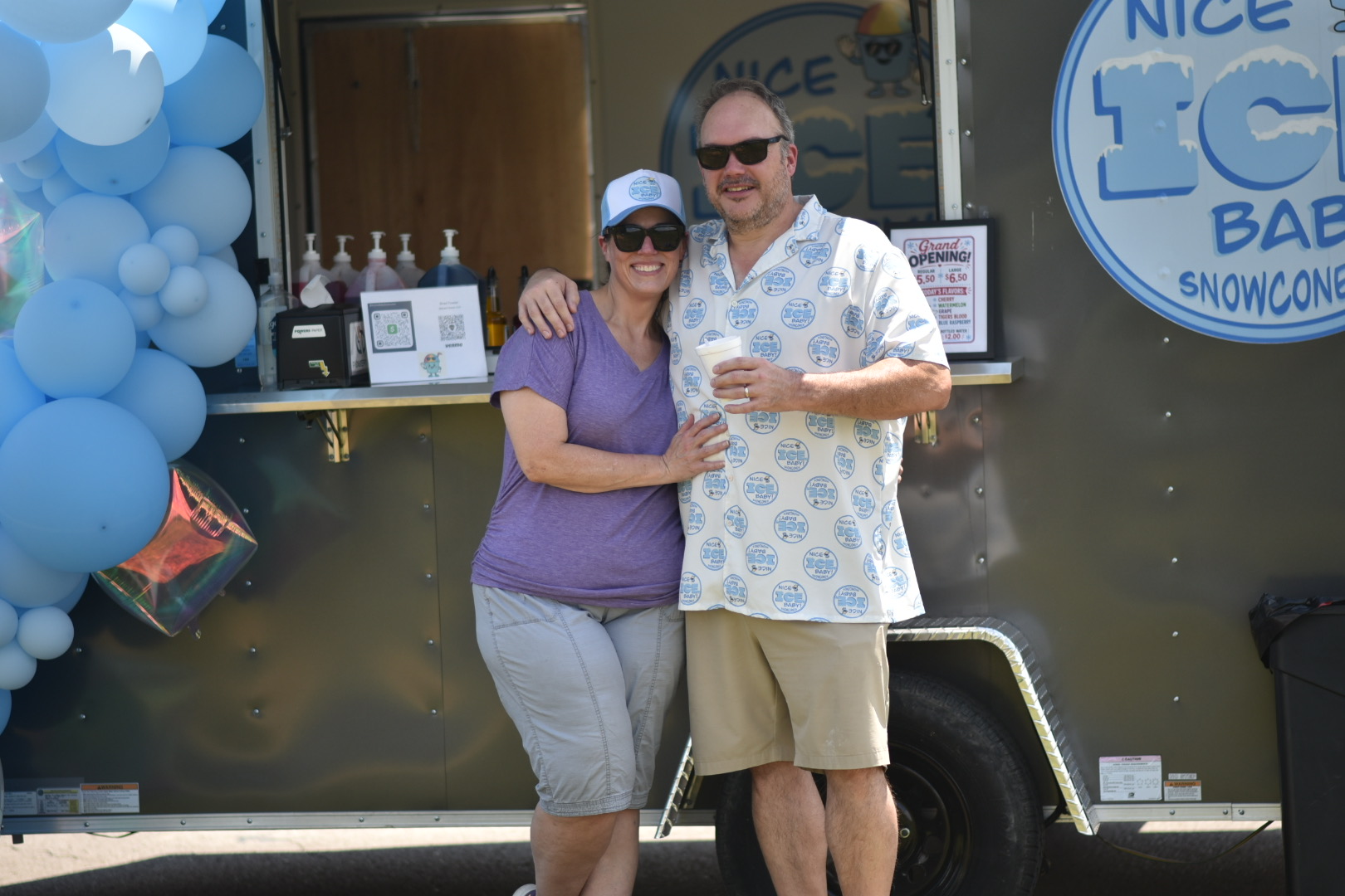 The Nice Ice Baby owners standing together in front of the truck